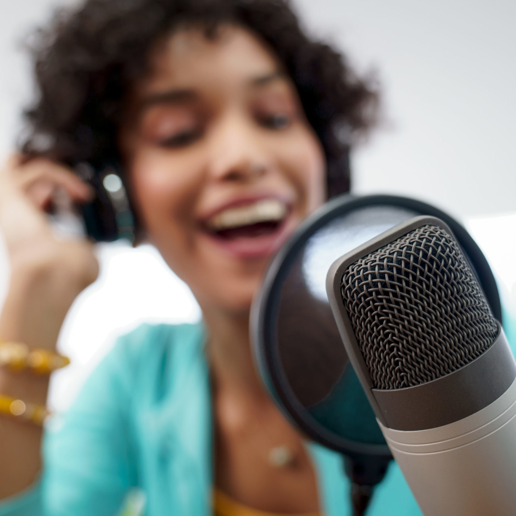 Attractive African American Young Woman Doing Online Podcast With Microphone Female podcaster